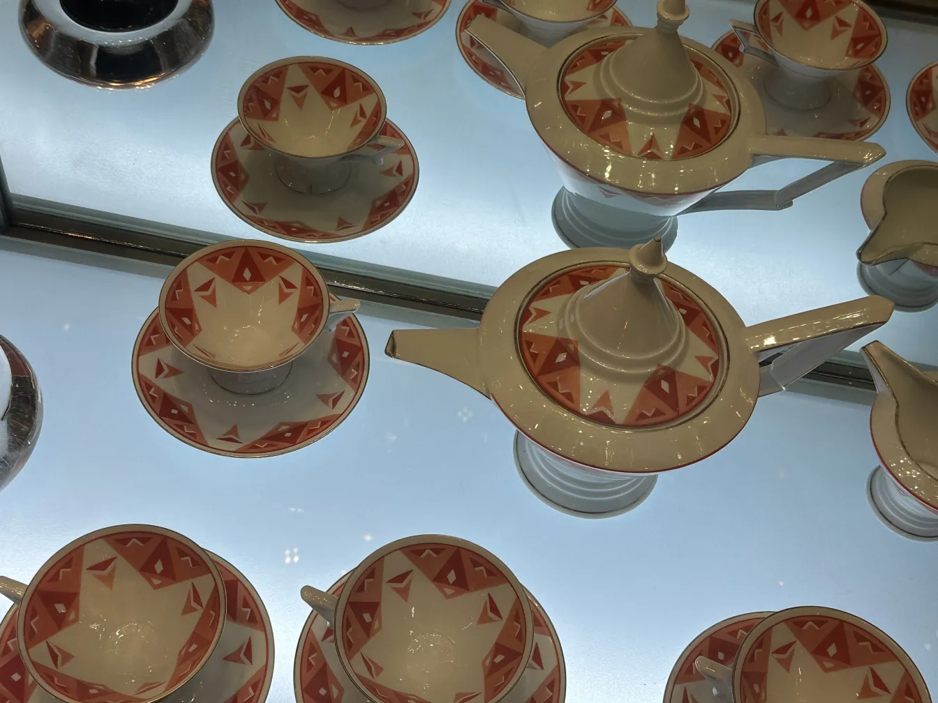 Antique tea set Volkstedt with colorful patterns on the table.