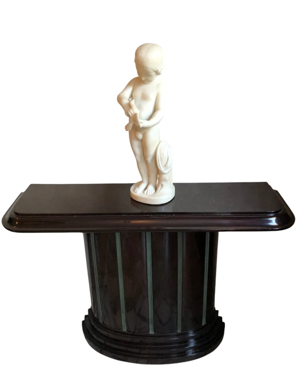 antique sculpture of a child holding a bird