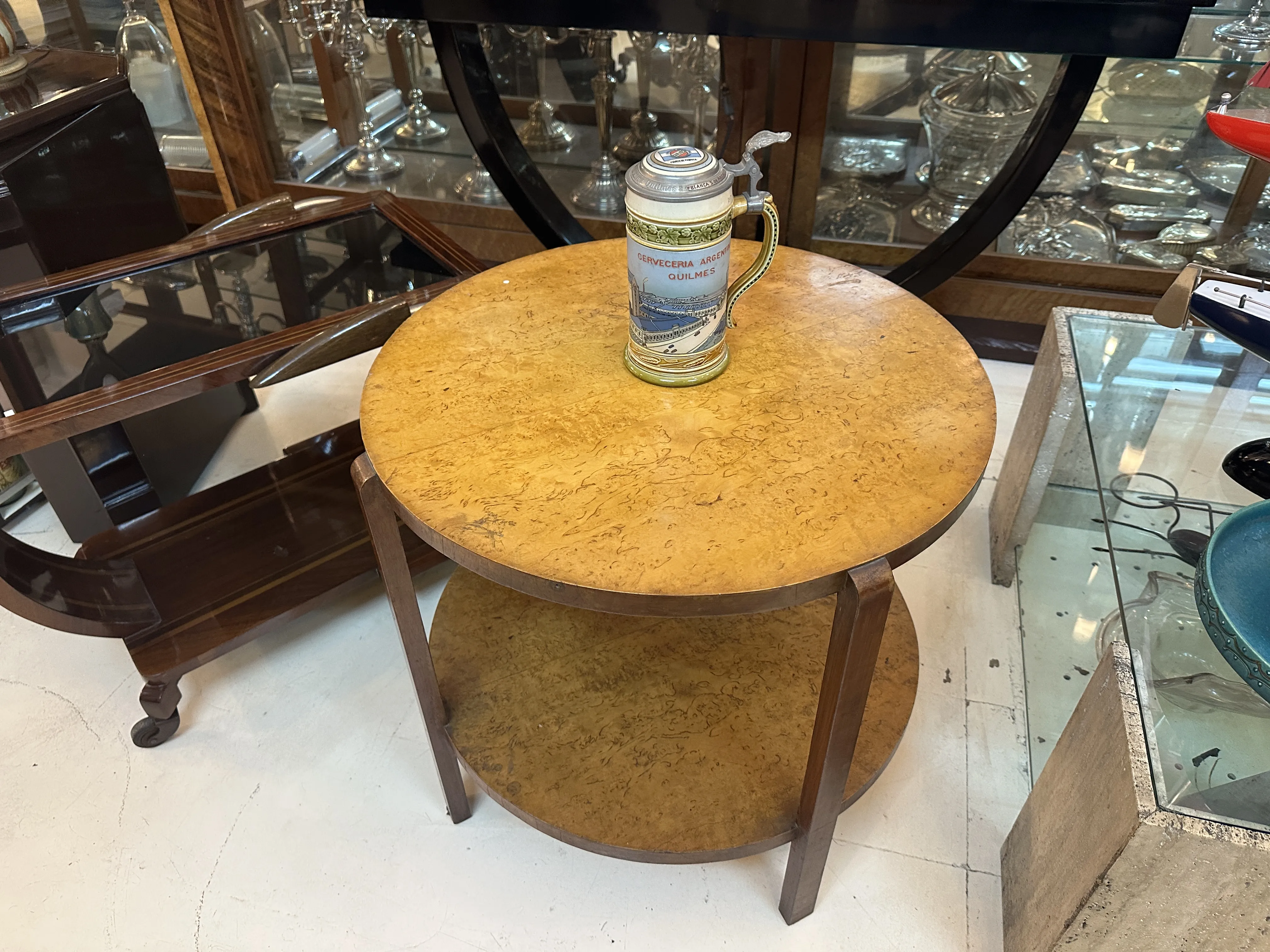 round wooden table with ceramic on top in elegant setting