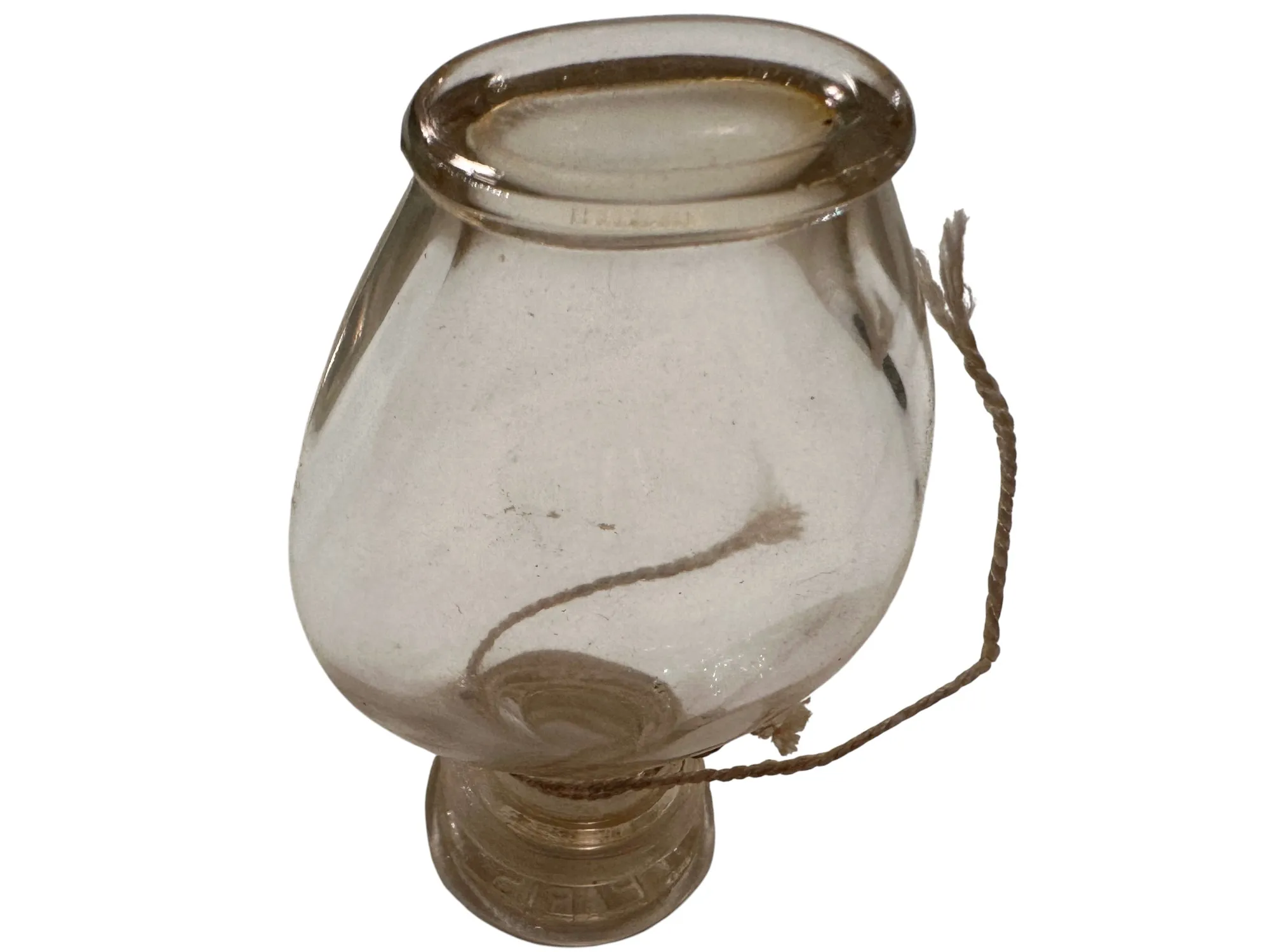 flacon de parfum ancien transparent avec ficelle