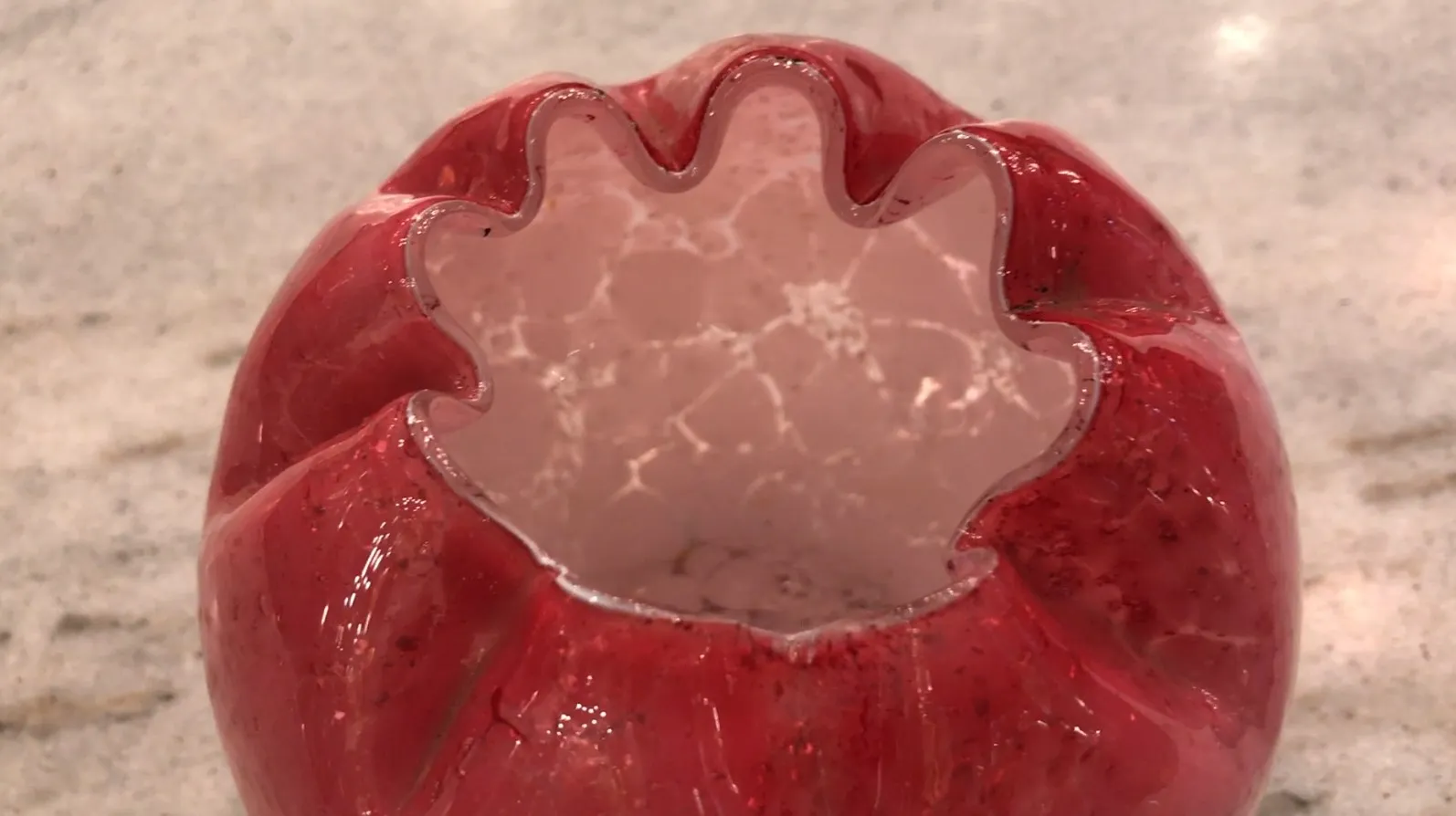 antique glass piece with wavy red design