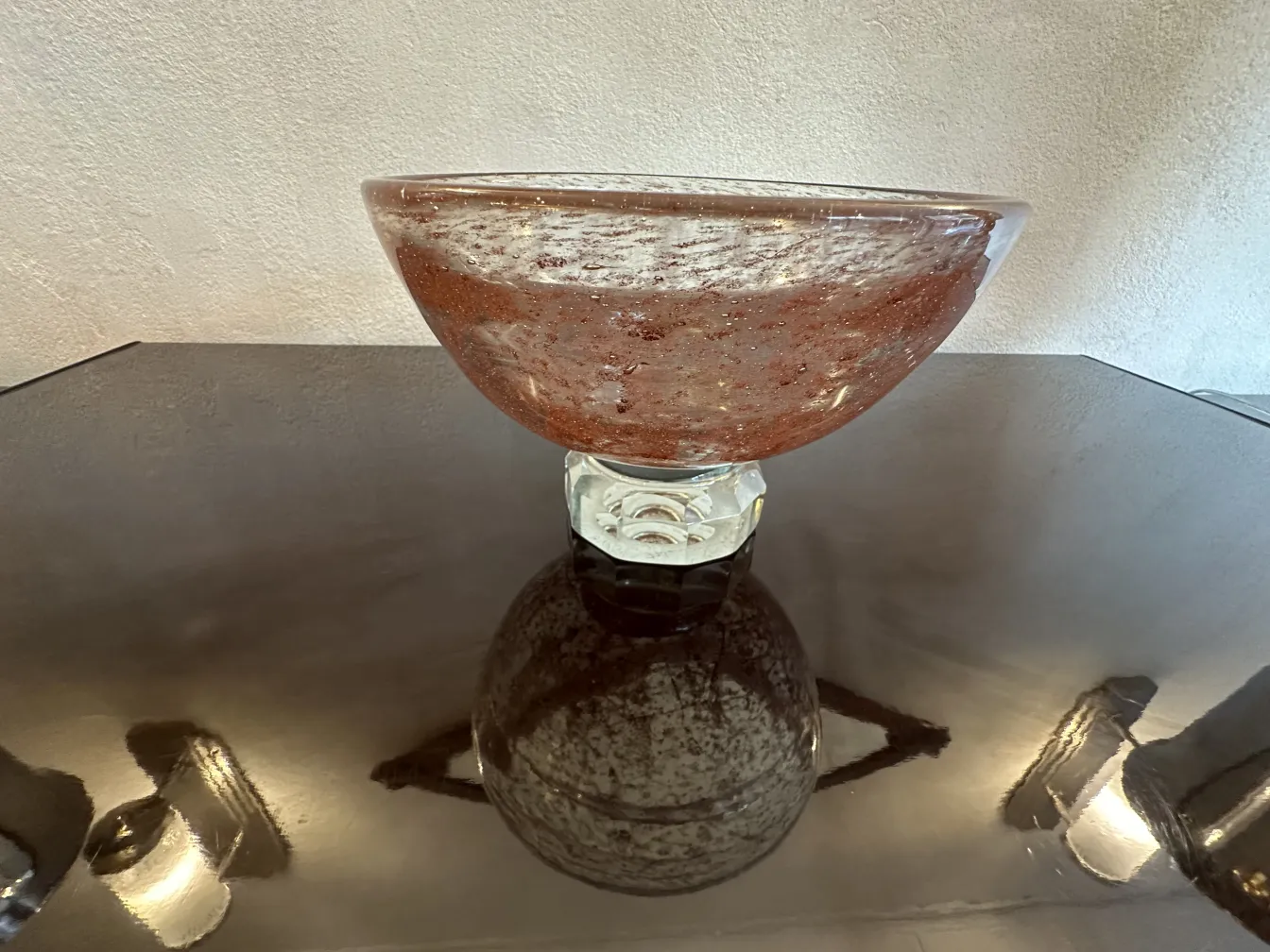 Antique signed Marinot glass with bright red hue on clear base, showing visible details.
