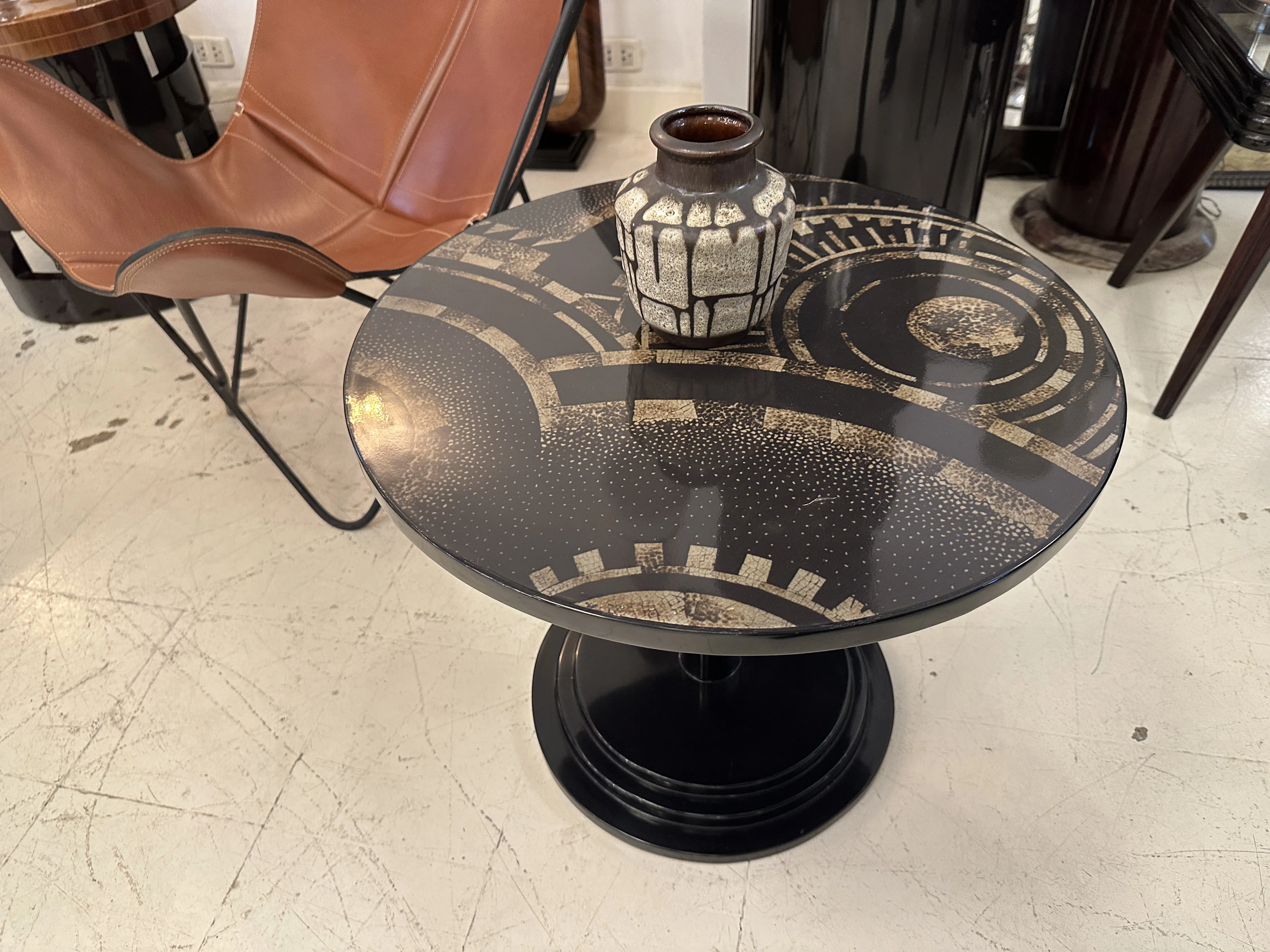 Antique ceramic vase on decorative patterned table