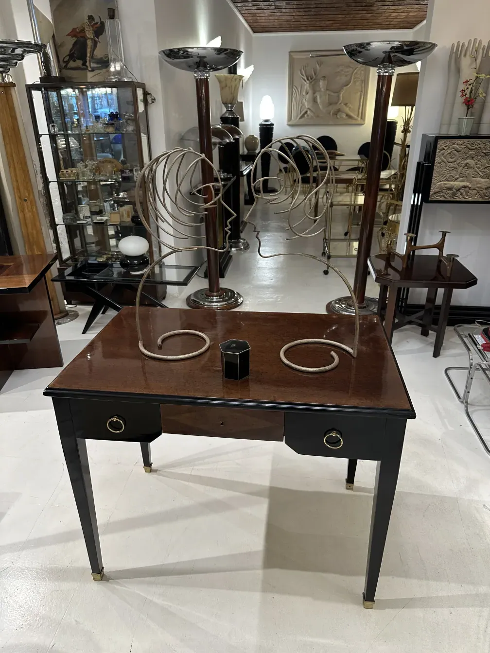 antique decorative box with elegant design, various objects in background
