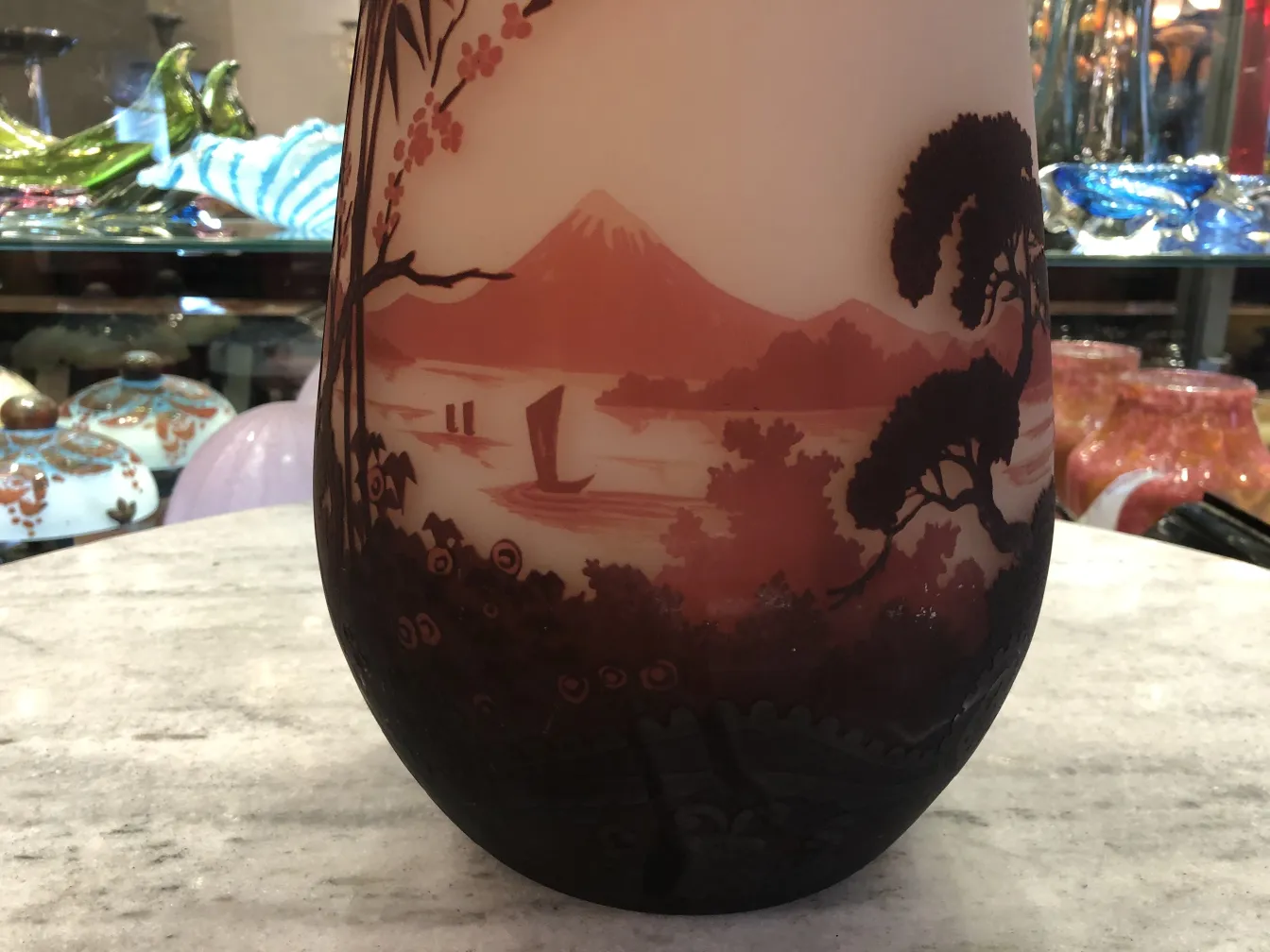 antique glass featuring figures and landscape design