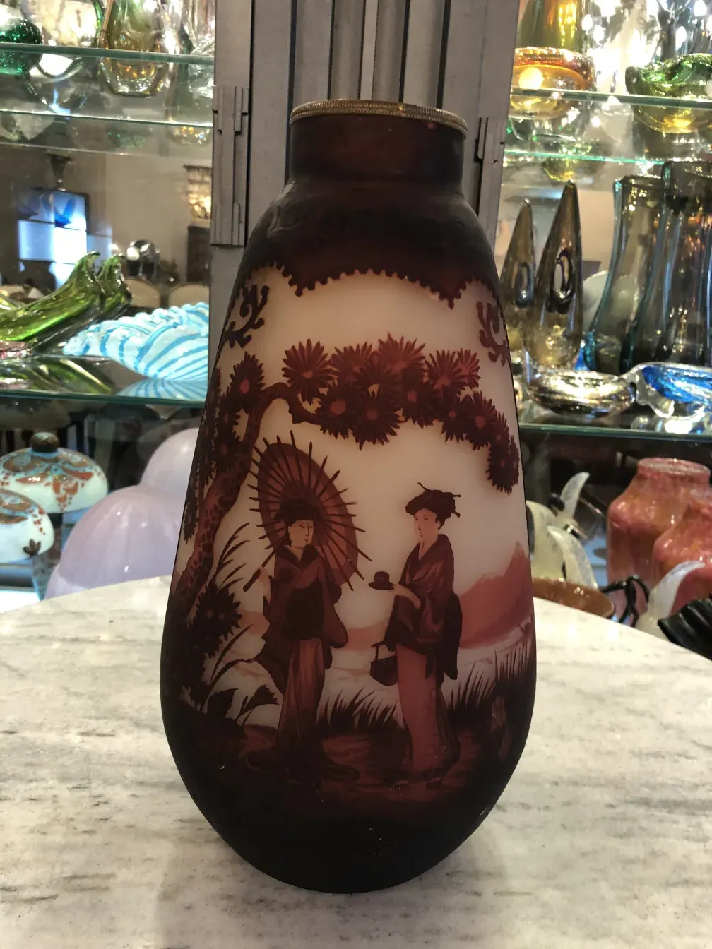 antique glass featuring figures and landscape design