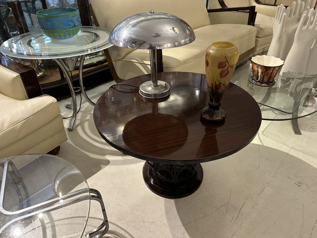 Curved, decorated antique glass vase signed by Lorrain in a stylish vintage setting.