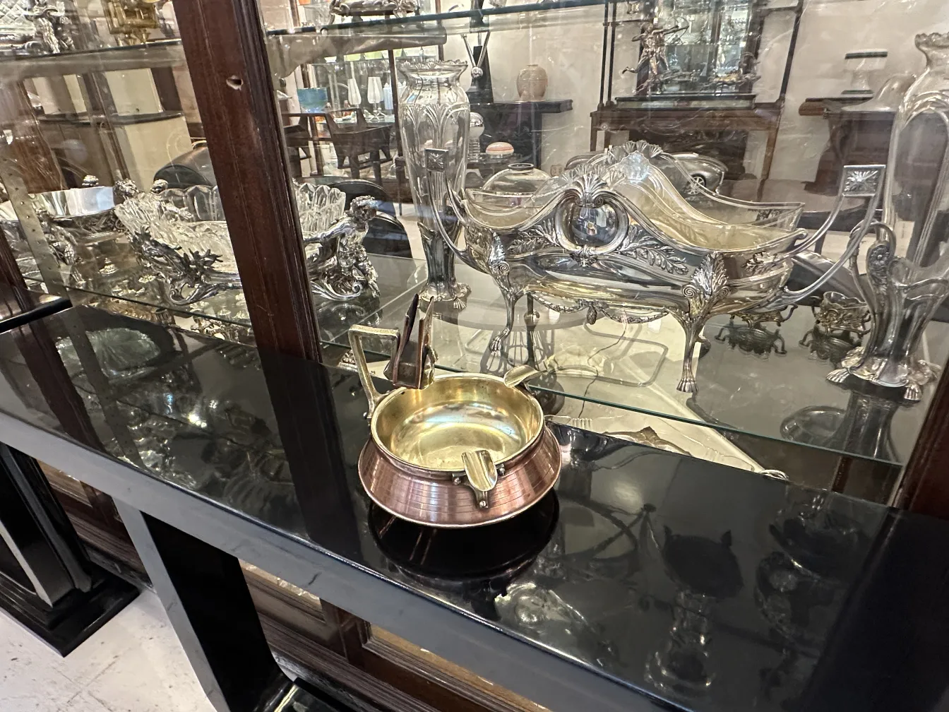 Antique ashtray on table with black surface