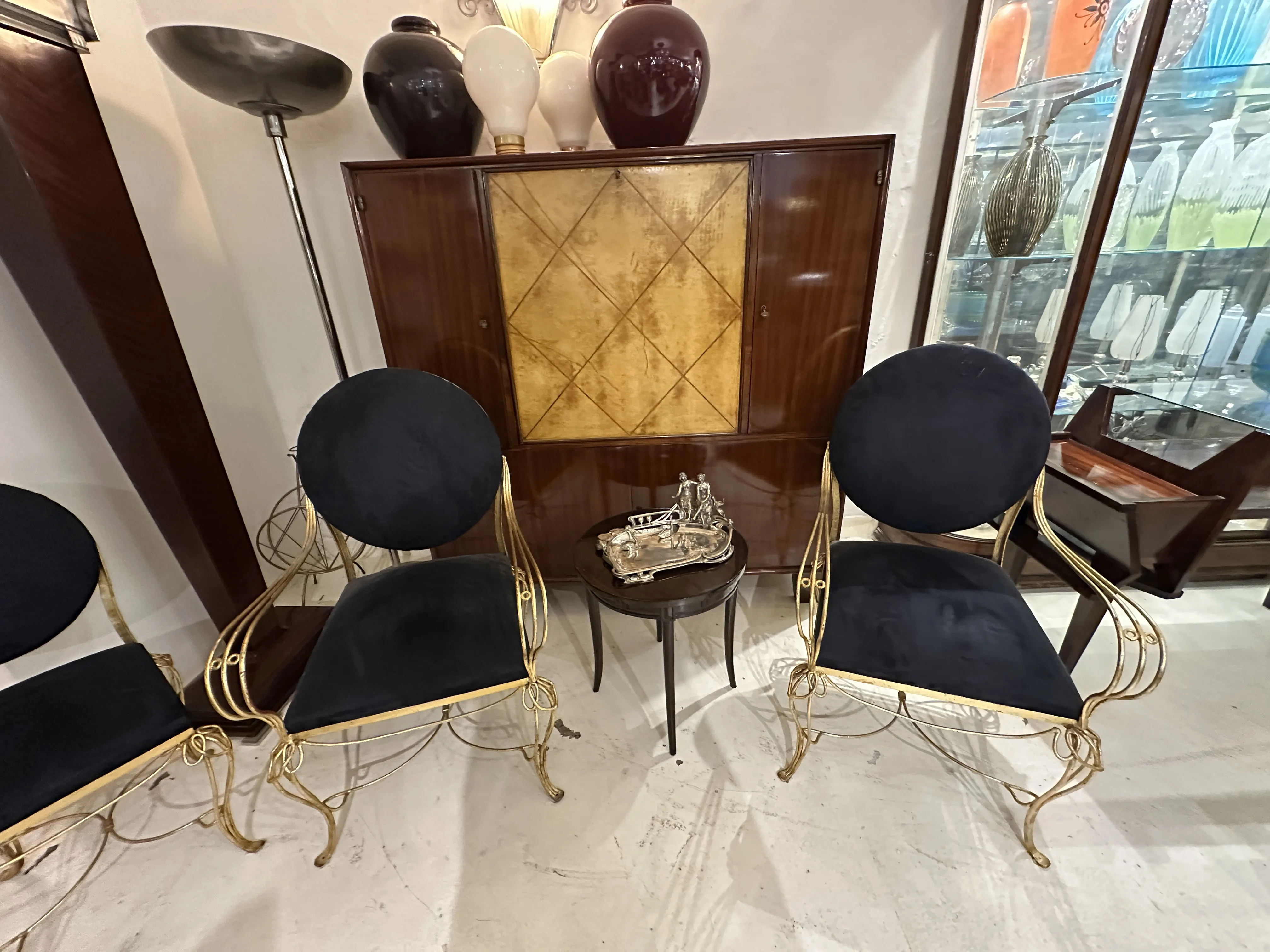 Antique card tray WMF displayed among stylish chairs