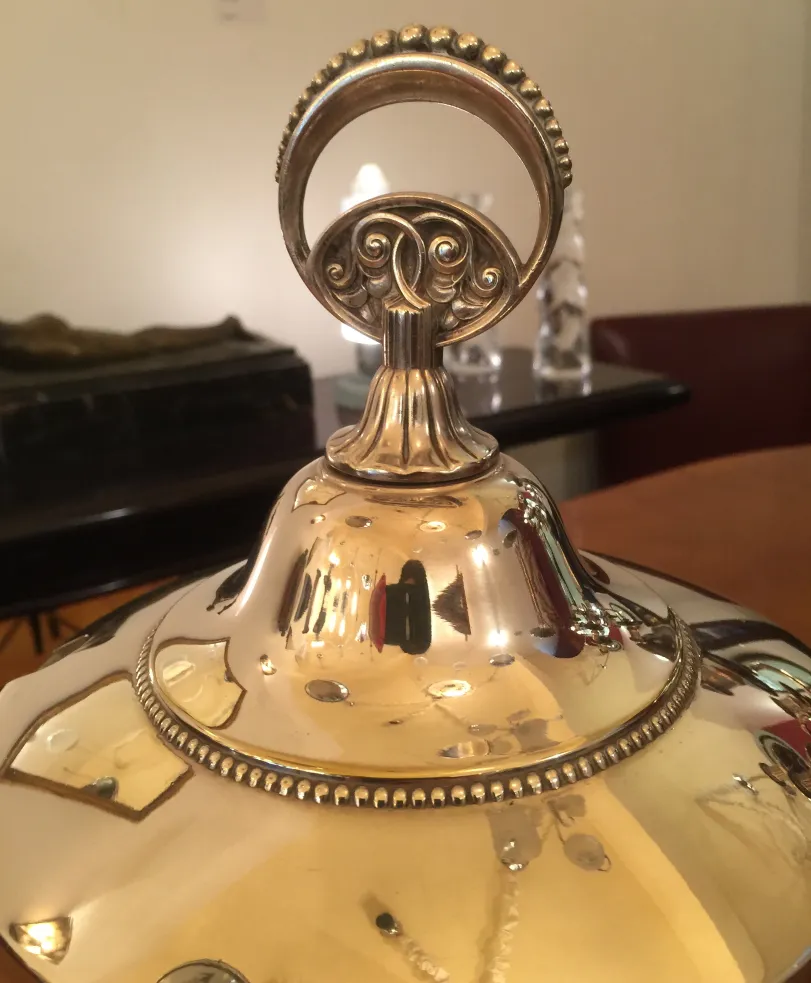 antique wmF punch bowl featuring elegant design and ornamental handles, perfect for special occasions.