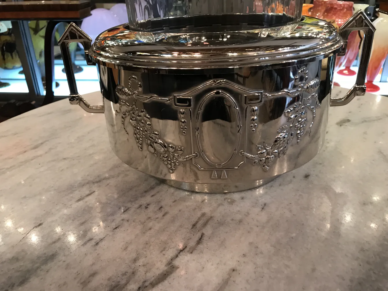 Antique WMF punch bowl with intricate design and crystal lid.