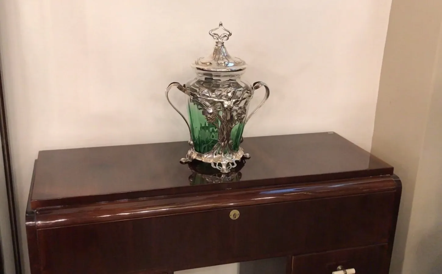 Antique WMF punch bowl with decorative green accents and lid, perfect for displays.