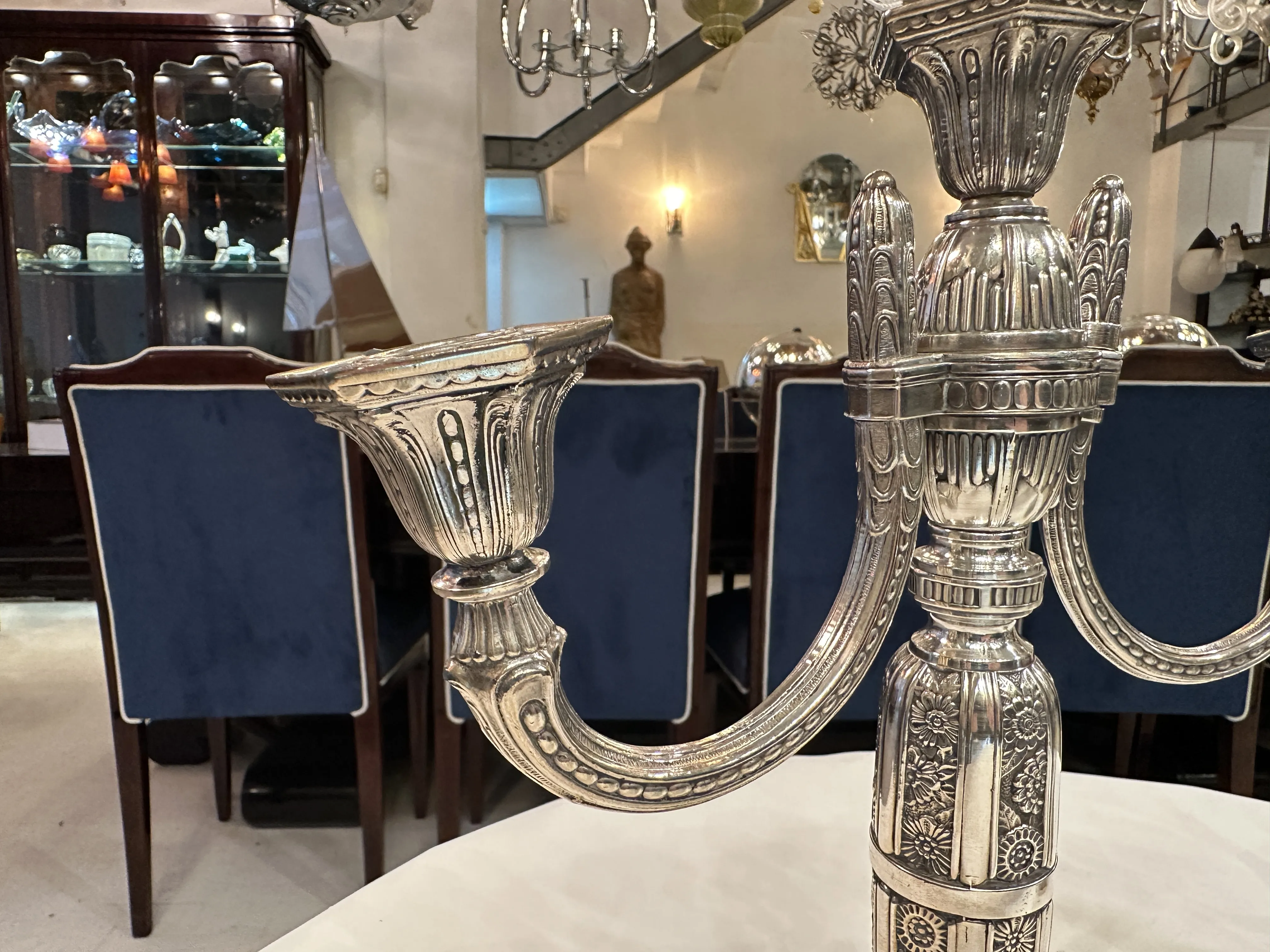 Two elegant antique candle holders in a classic setting