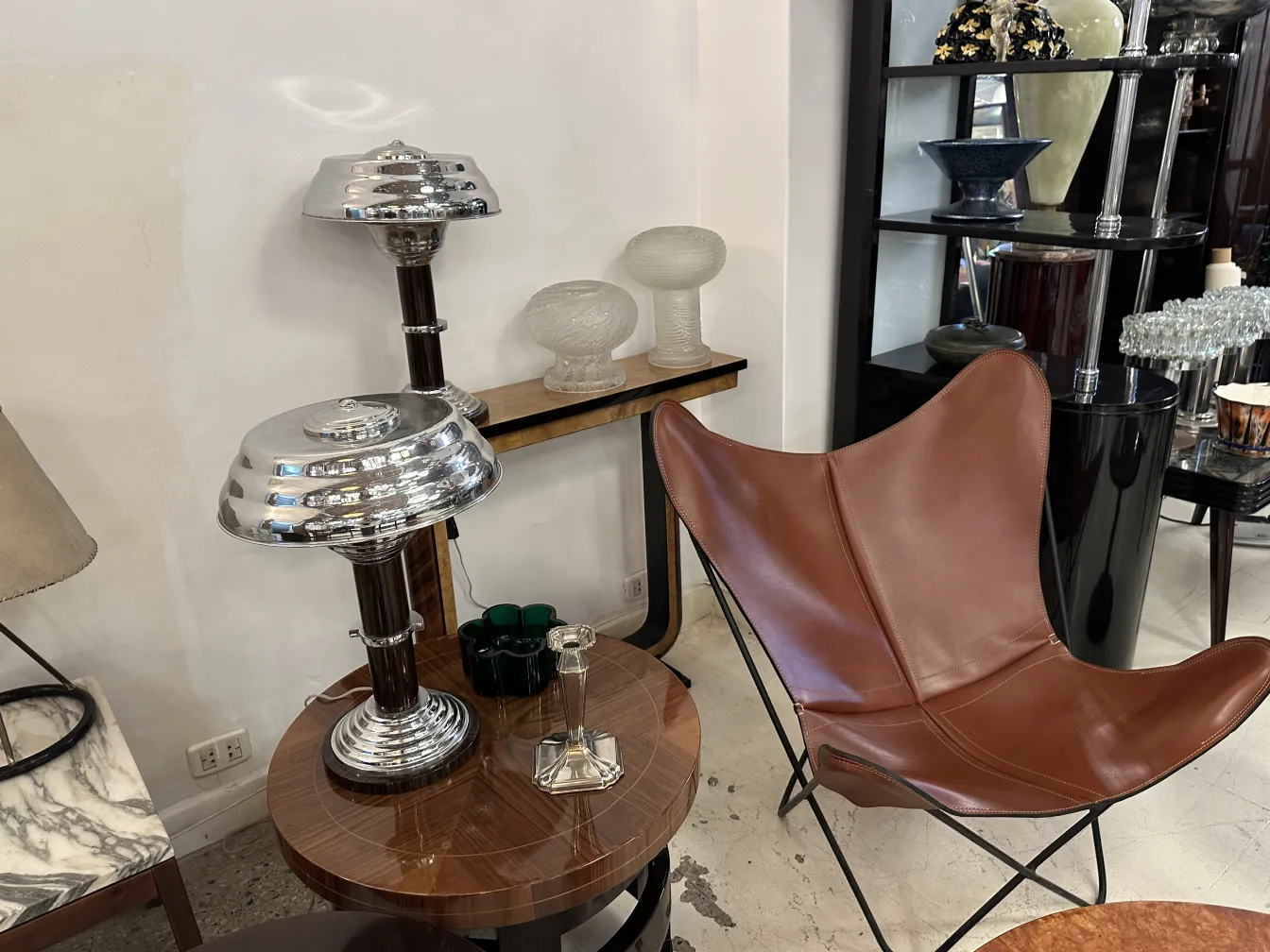 Antique decorative candelabra featuring elegant base and symmetrical design.