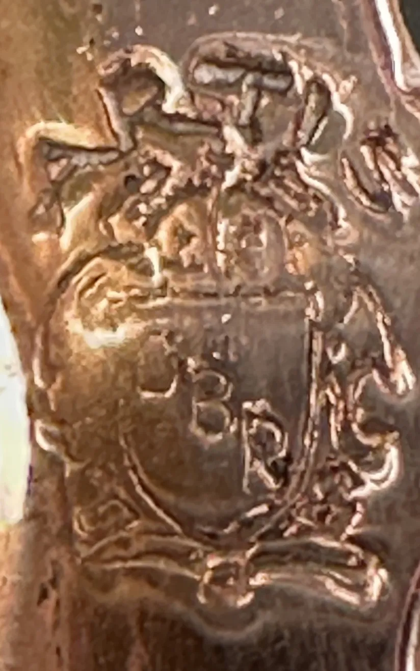Antique decorative candelabra featuring elegant base and symmetrical design.