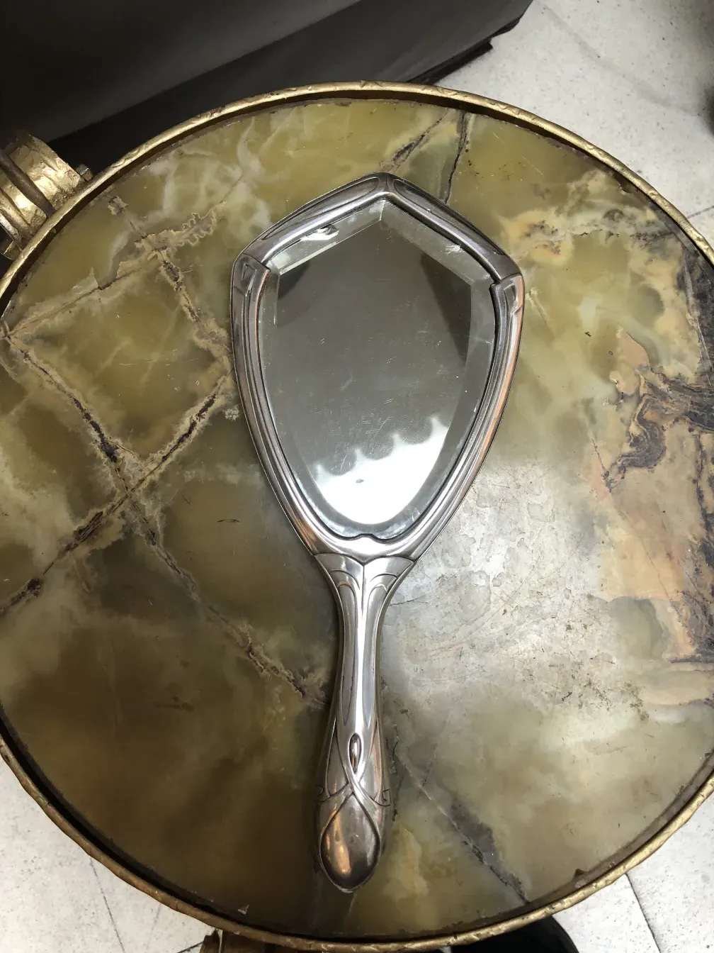 Antique hand mirror with an elegant design