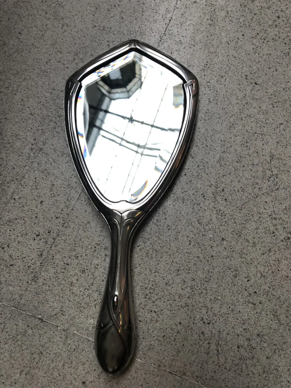 Antique hand mirror with an elegant design