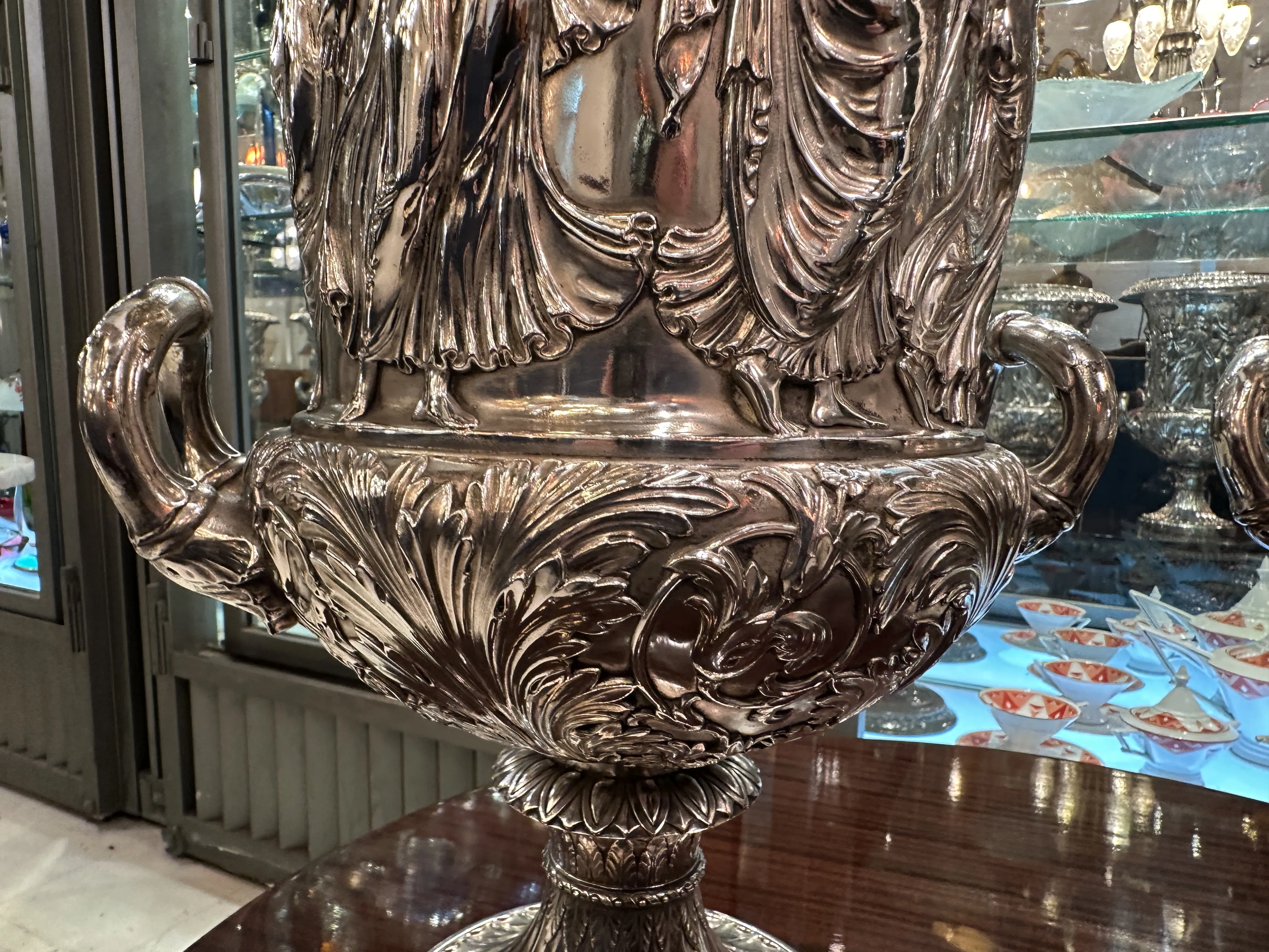 2 antique wmF champagne coolers with fine decorative details and an elegant background.