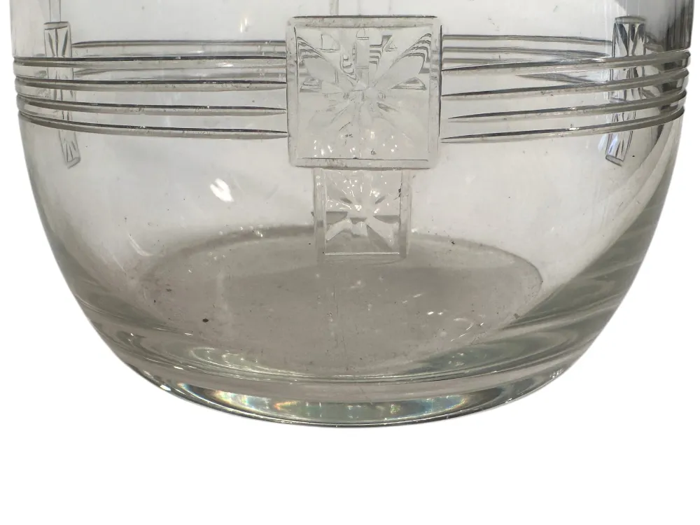 Two antique WMF jars featuring decorative details and an elegant design in a classic setting.