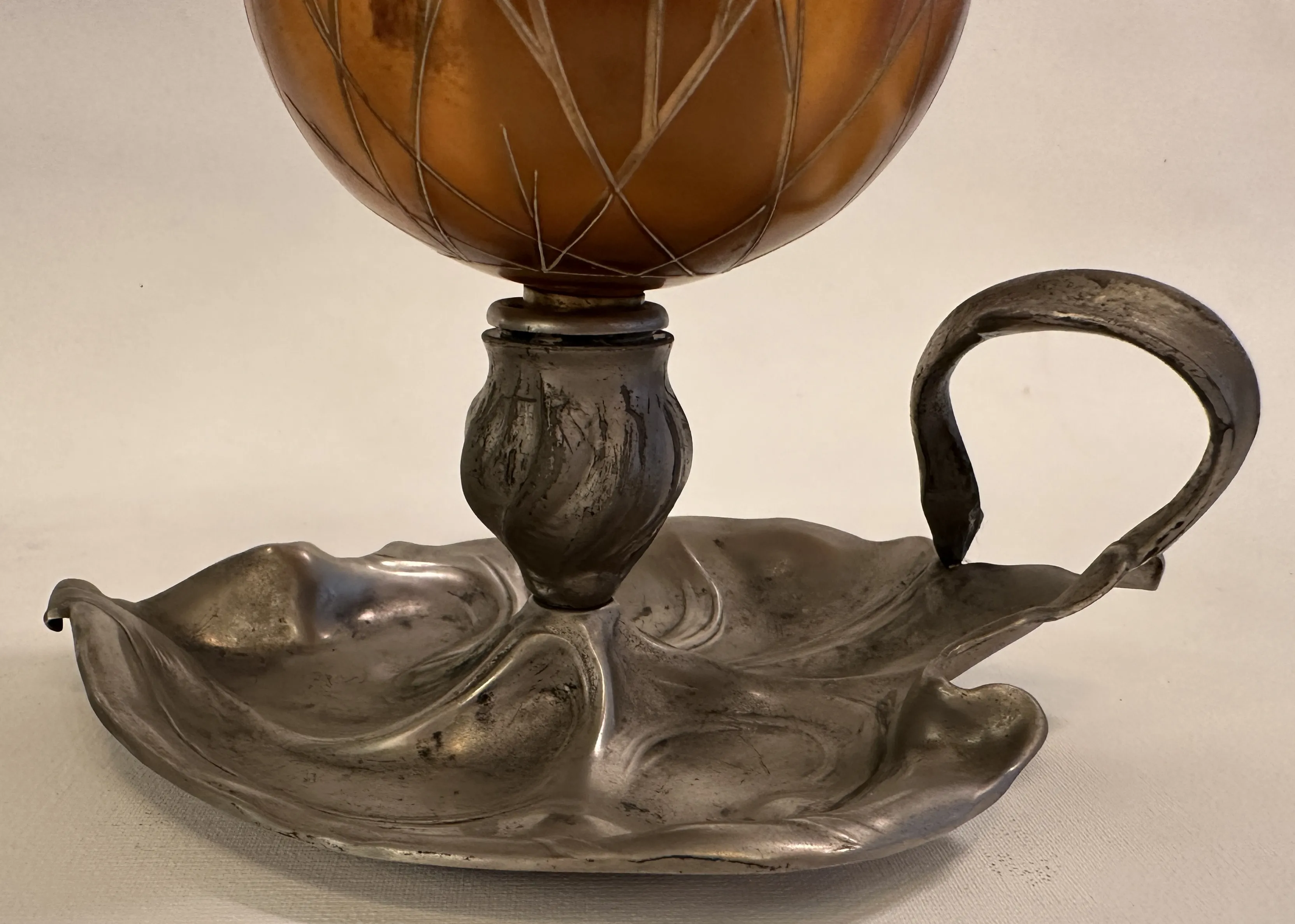 antique lamp with a floral-shaped decorative base