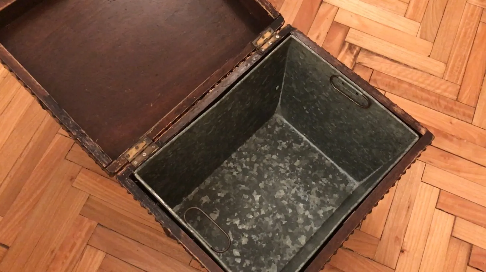 Antique bar with an open lid, interior view.