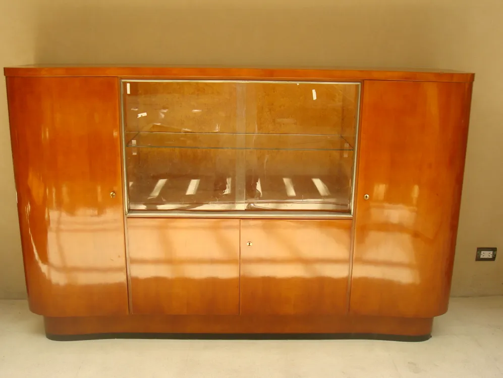 Antique bar cabinet with wooden finish and clear glass