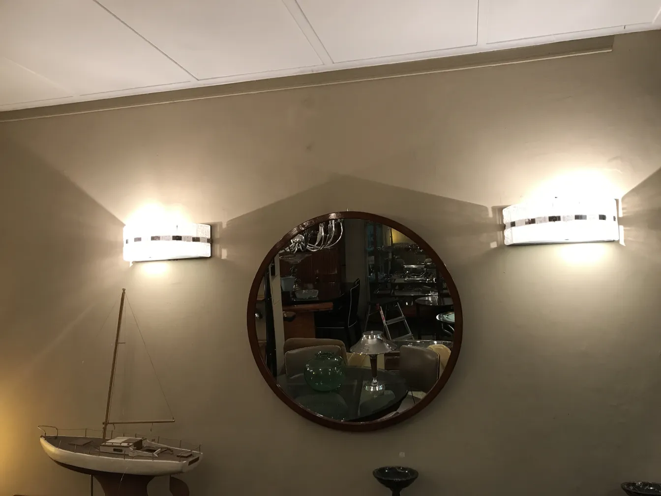 Antique pair of sconces with elegant design on the wall