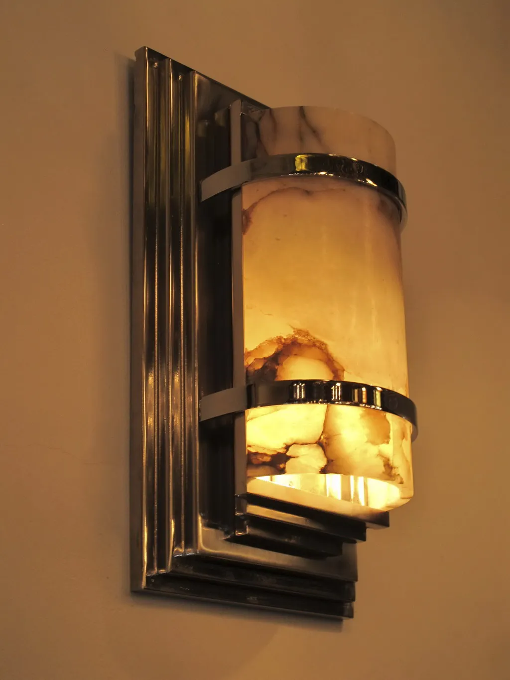 Elegant antique pair of sconces emitting warm light