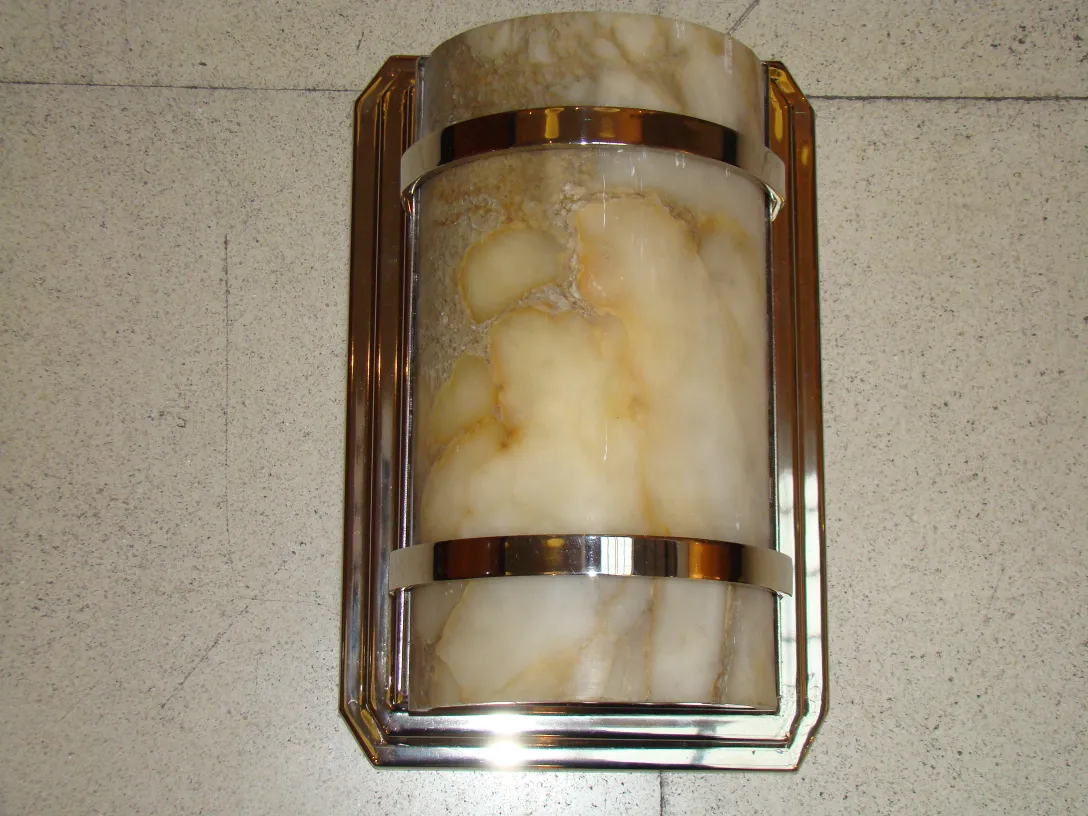 Antique pair of sconces with elegant wall design