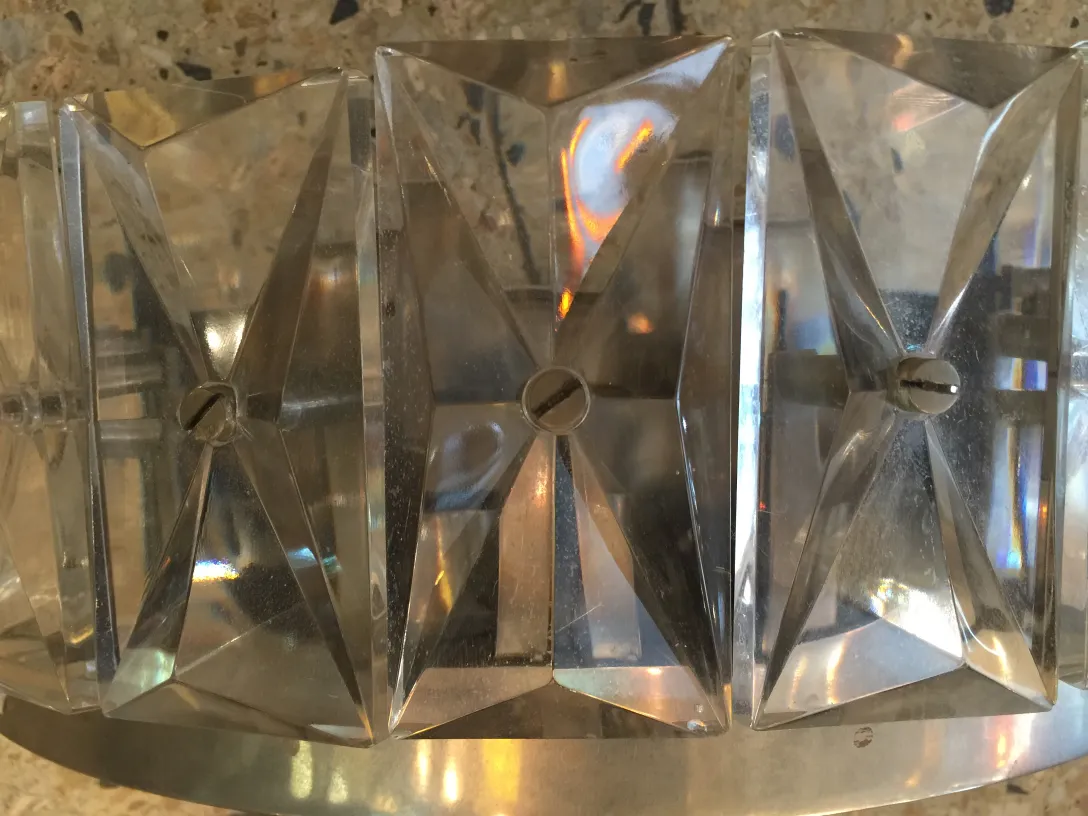 Pair of antique sconces with transparent design, softly illuminating