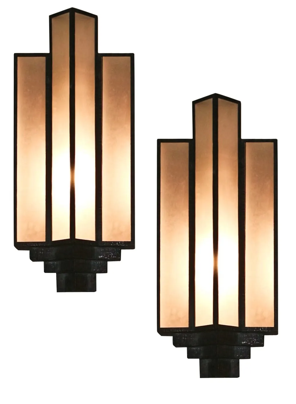 Antique wall sconces with soft lighting, stylish design.