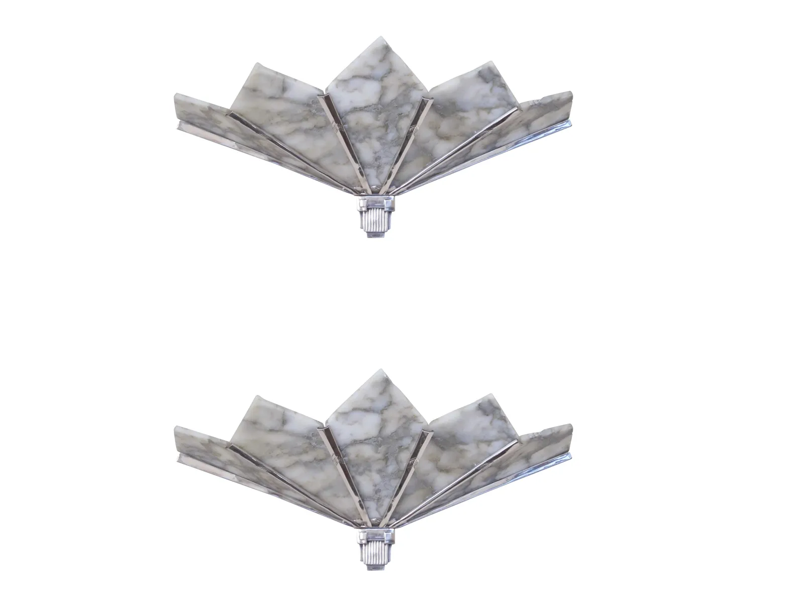 Pair of antique sconces with elegant design, set in a warm environment.