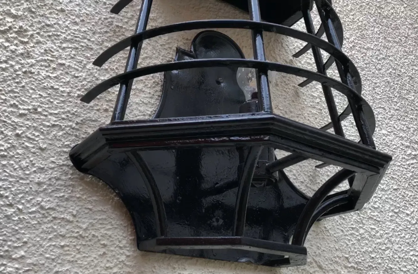 Pair of antique black sconces, ideal for vintage decor.