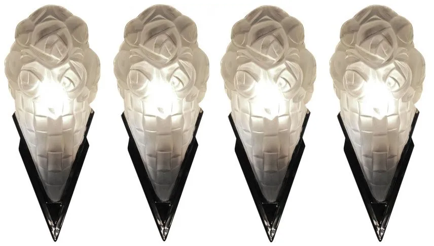 Pair of antique sconces featuring floral and figure designs.