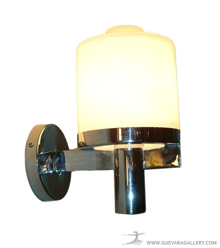 Antique pair of sconces with metal frame and white light, enhancing wall decor.