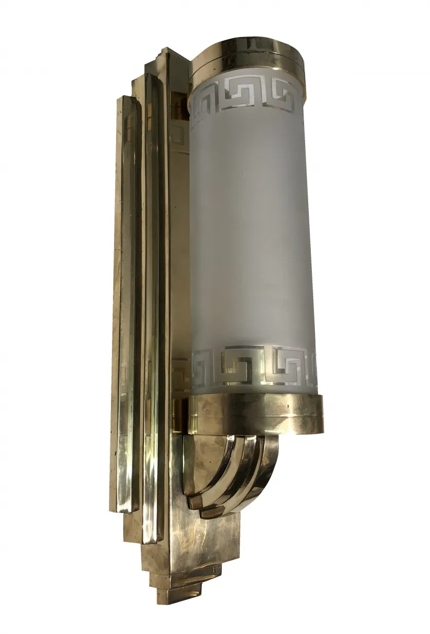 Antique pair of sconces featuring a golden base and white diffuser.