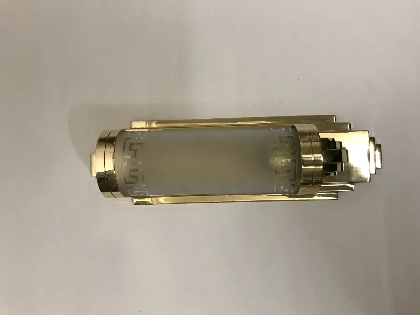 Elegant antique sconces with decorative details