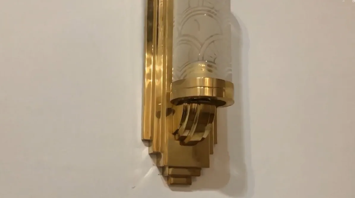 Two antique wall sconces with golden details