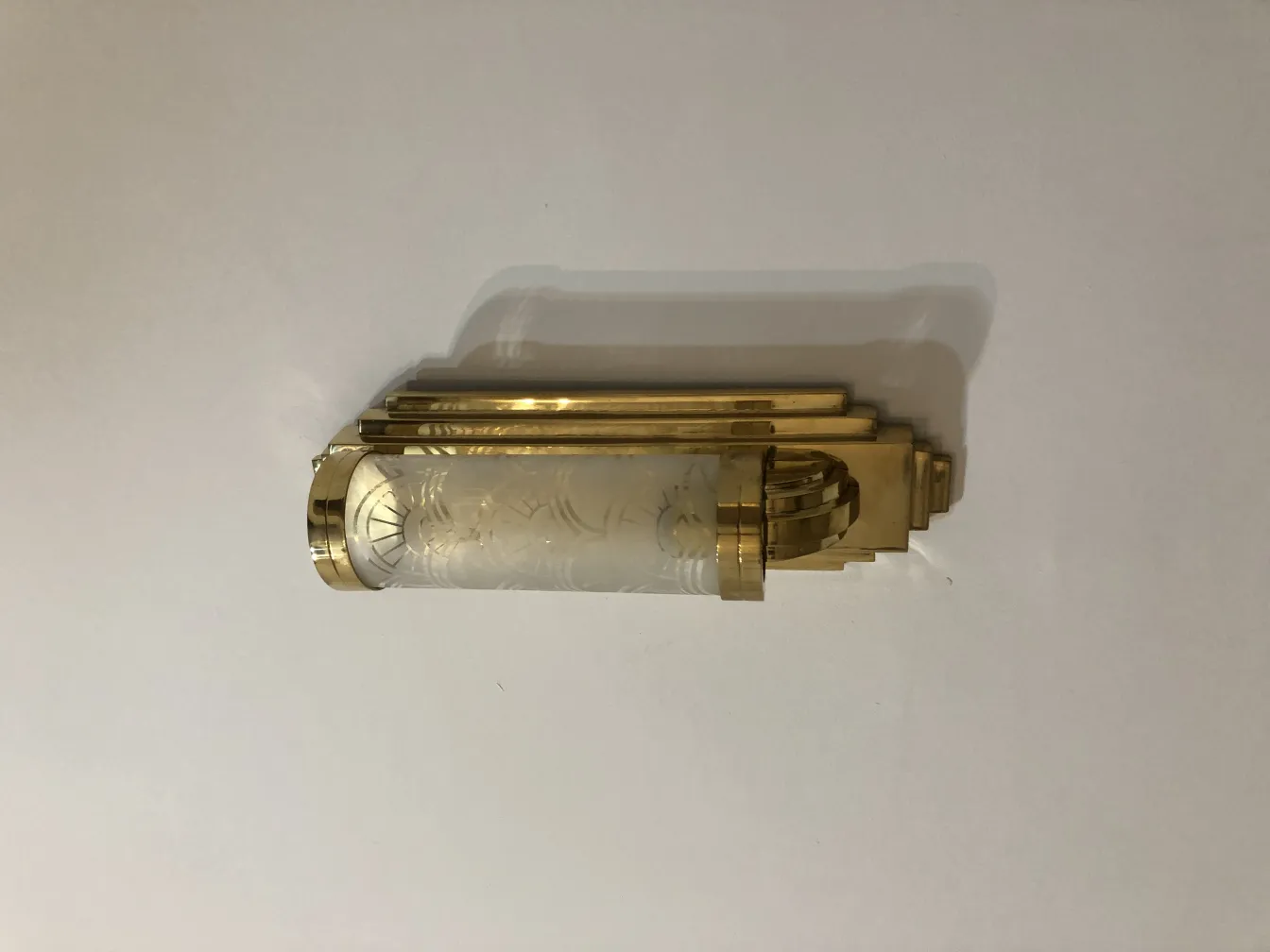 Pair of antique sconces with decorative design and details