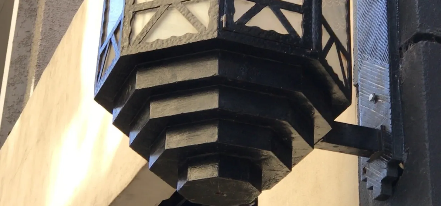 pair of antique sconces with decorative base details