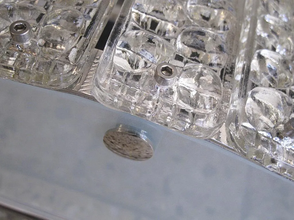 Pair of antique sconces with a translucent design in a contemporary setting.