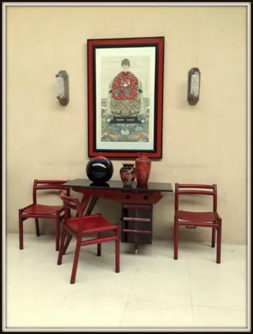 Pair of antique sconces on walls with art and decor