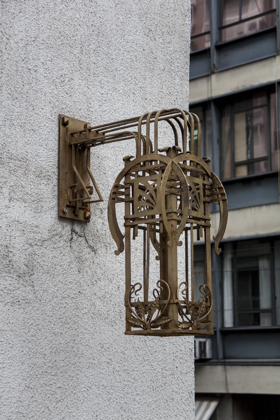 Antique sconces with ornate design on the wall.