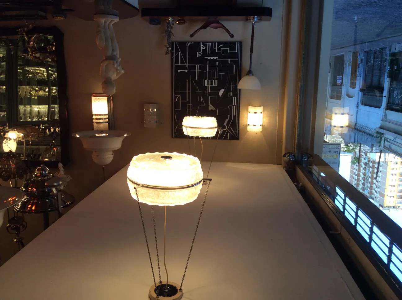 Pair of antique sconces with illuminated lamps