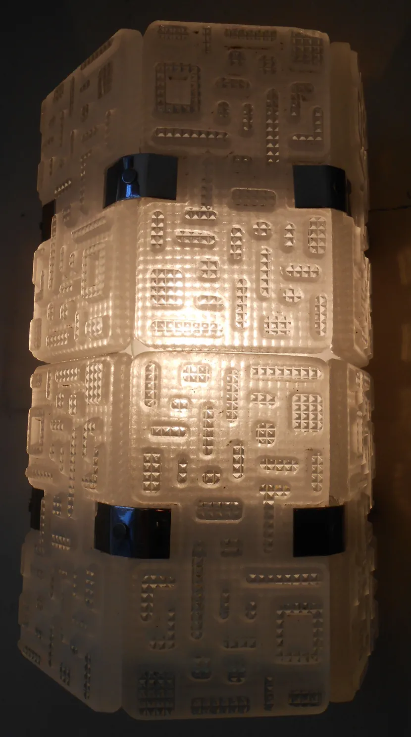 Antique pair of sconces with decorative relief design