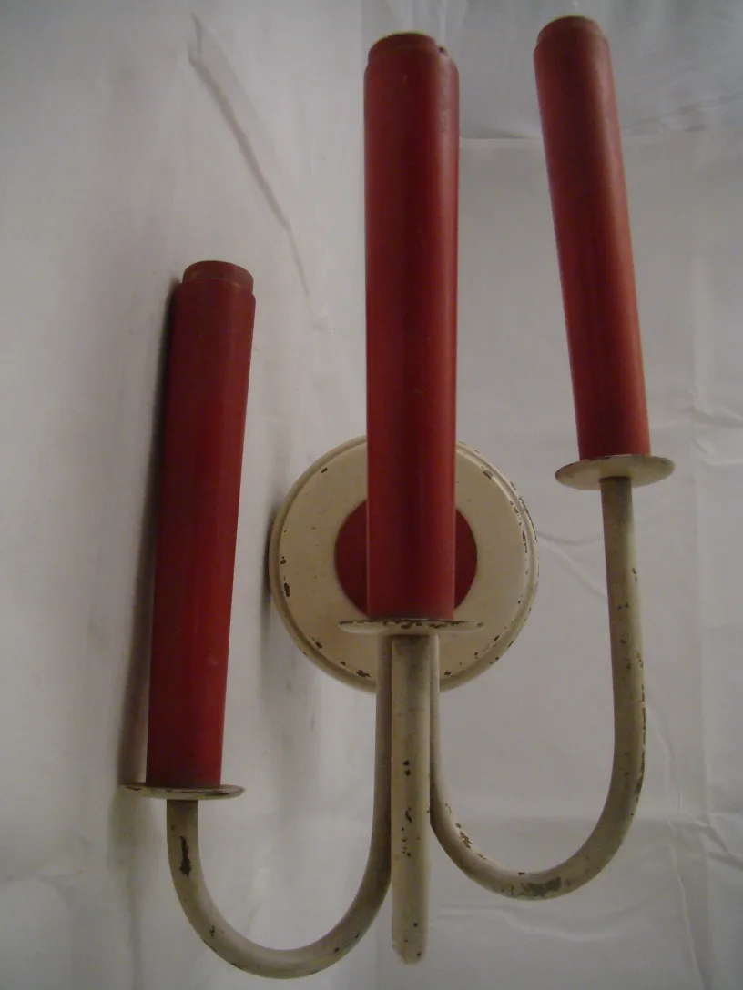 Pair of antique sconces with red arms and round base, retro style.