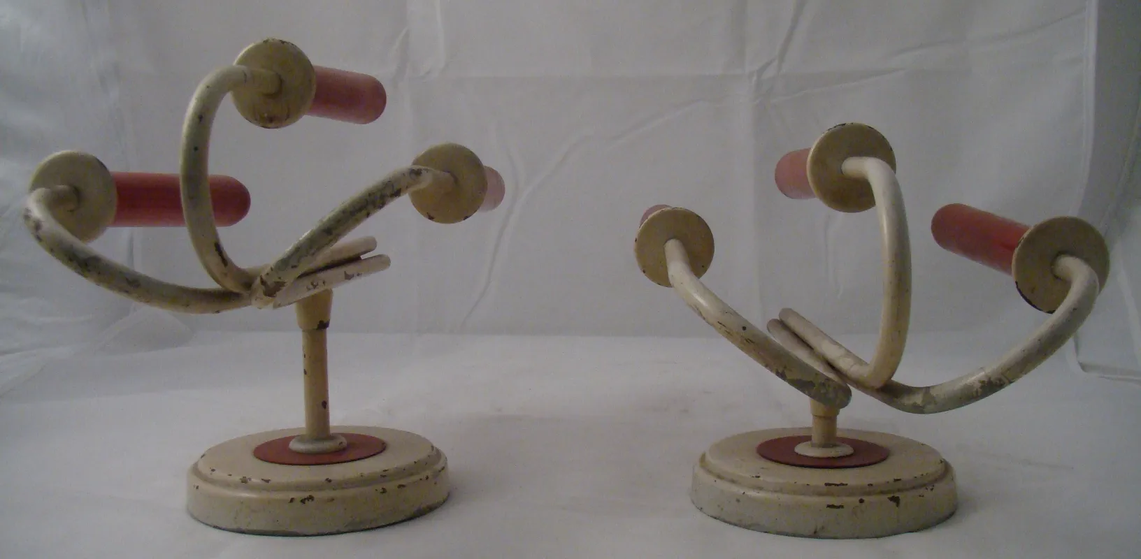 Antique pair of sconces with curved arms and round bases