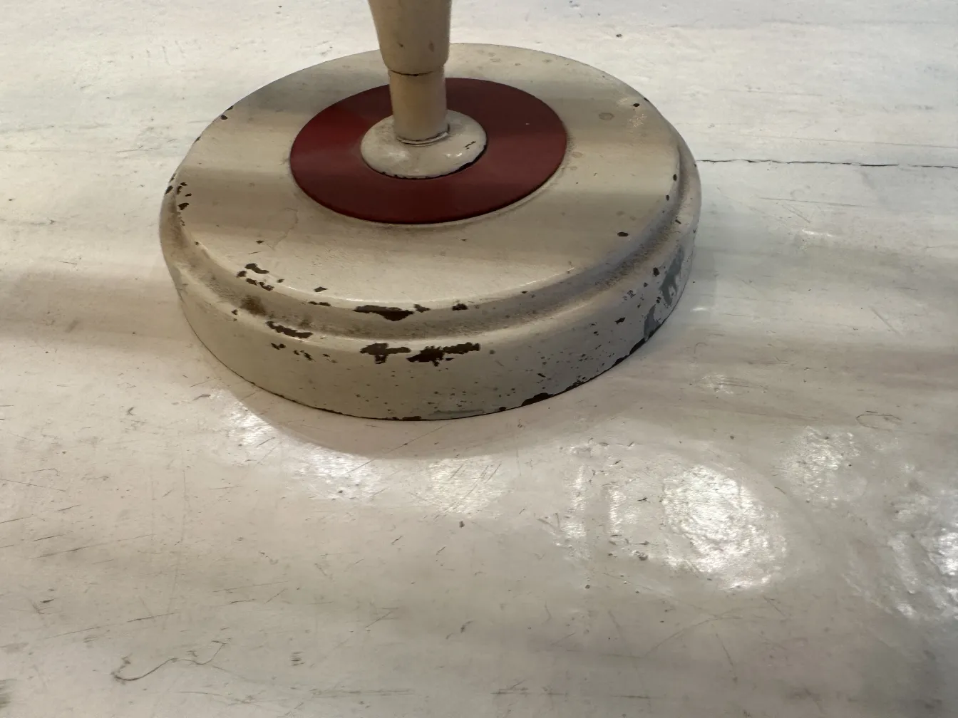 Worn round base of antique sconces with vintage details.