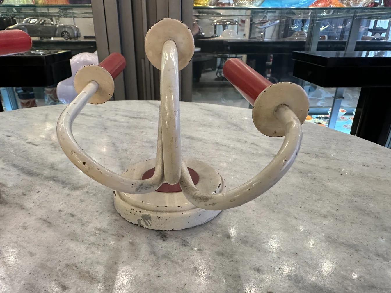 antique pair of sconces Jean royère with vibrant details in the background