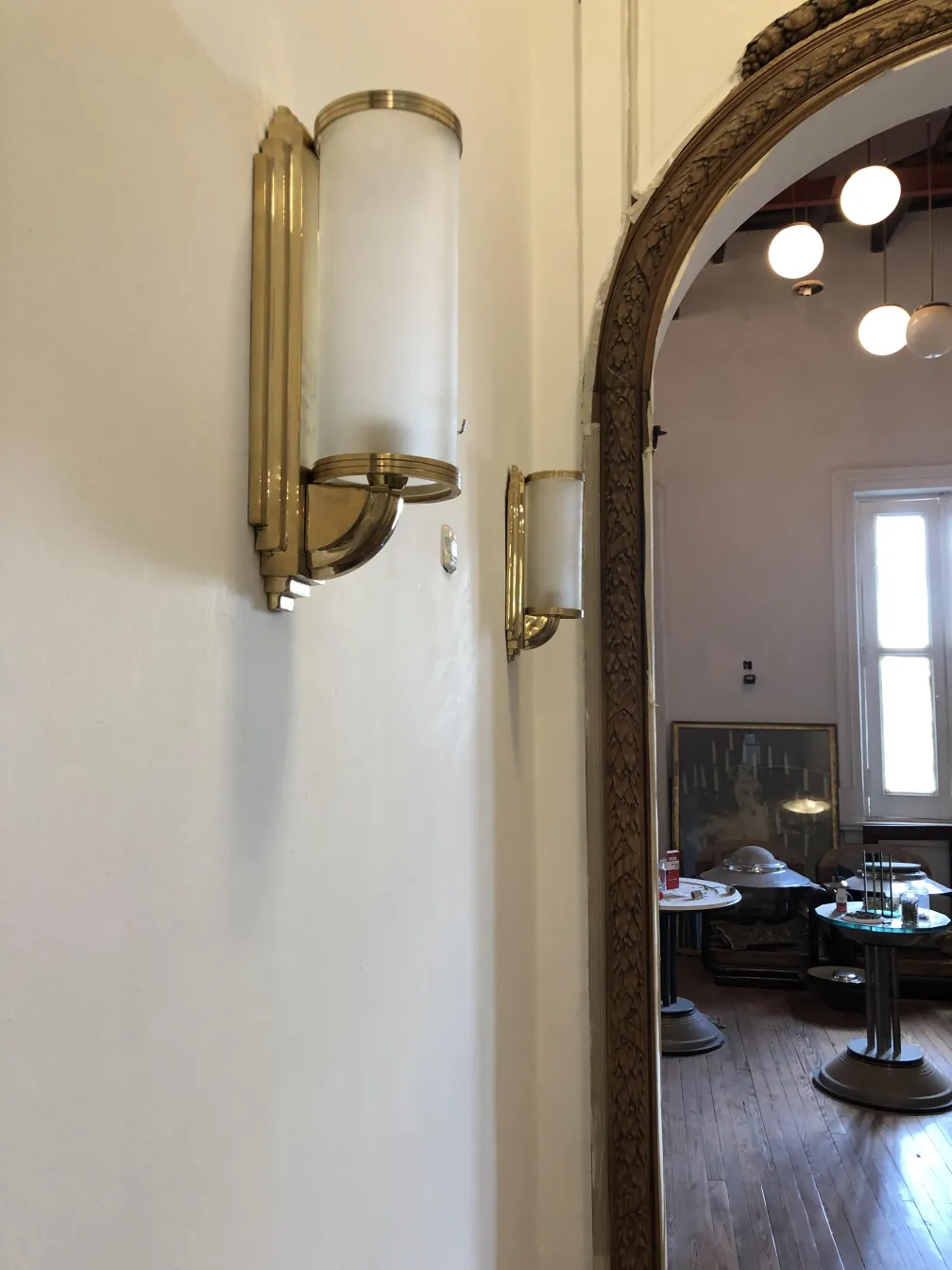 Antique wall sconces with classic design on the wall.